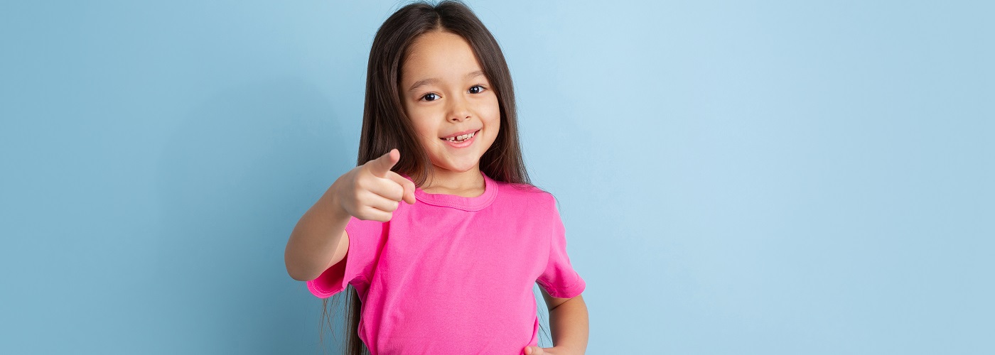 caucasian-little-girl-portrait-blue-studio-wall