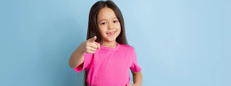 caucasian-little-girl-portrait-blue-studio-wall