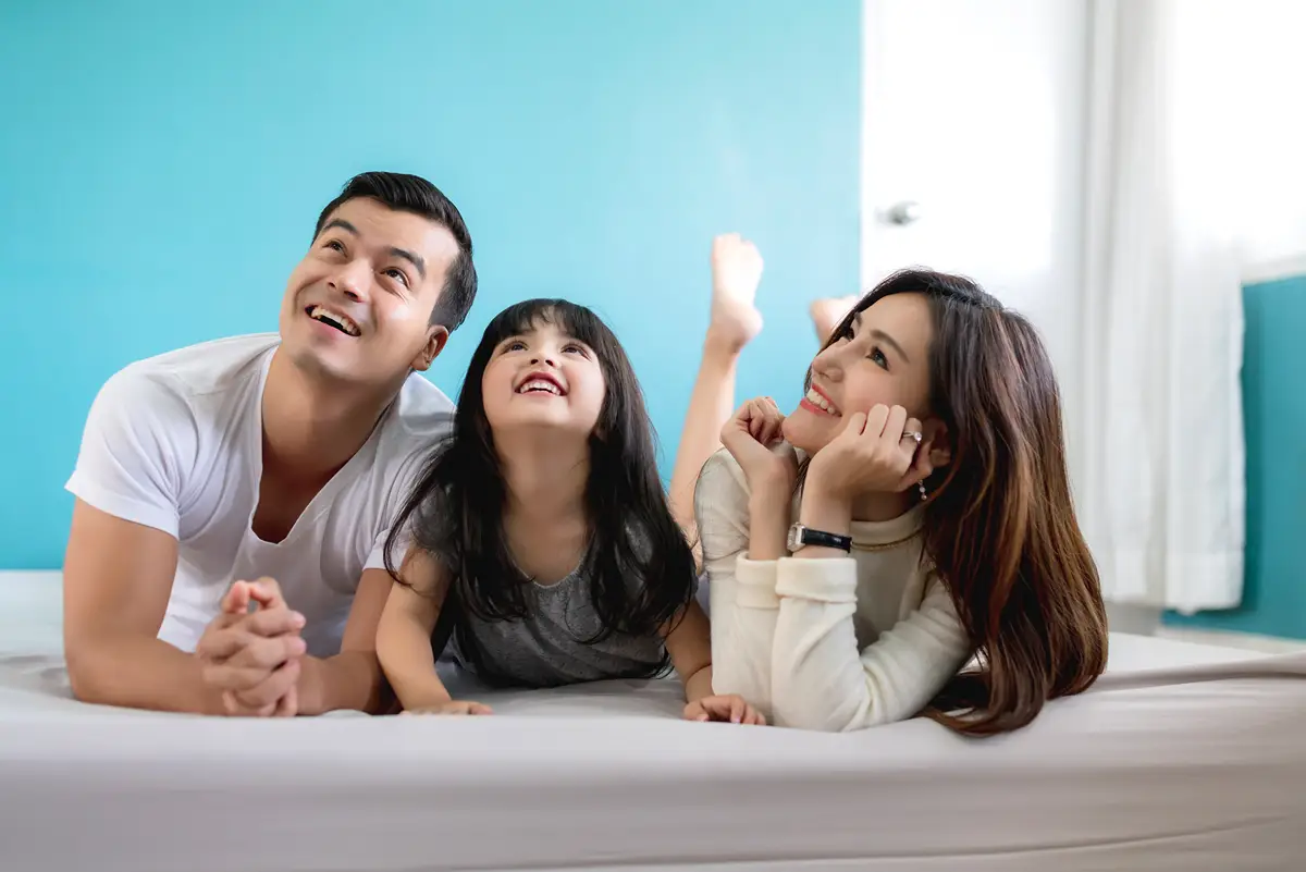rsz_1happy-asian-family-mother-father-daughter-making-fun-sleep-play-living-room-home-background image