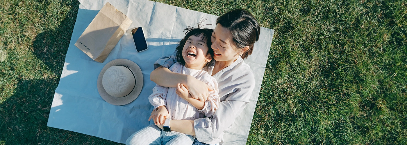 mother is happy her child has overcome finger-sucking