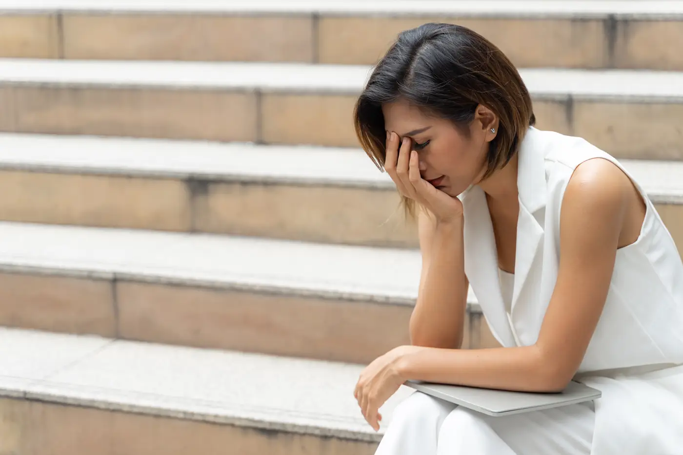 sadness-young-woman-crying-stair