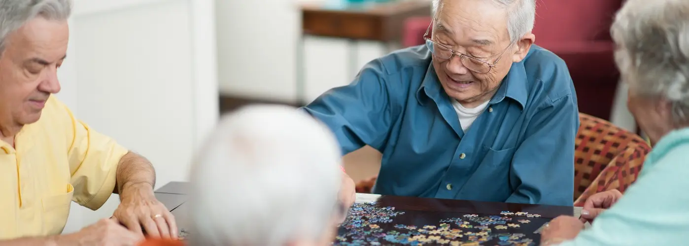 Old men playing puzzle